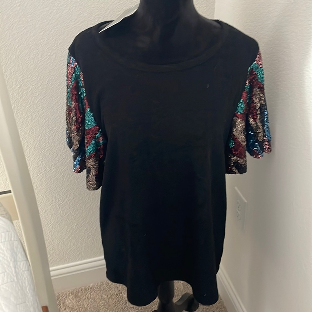 Darling black top with sequin sleeves! Cotton/poly